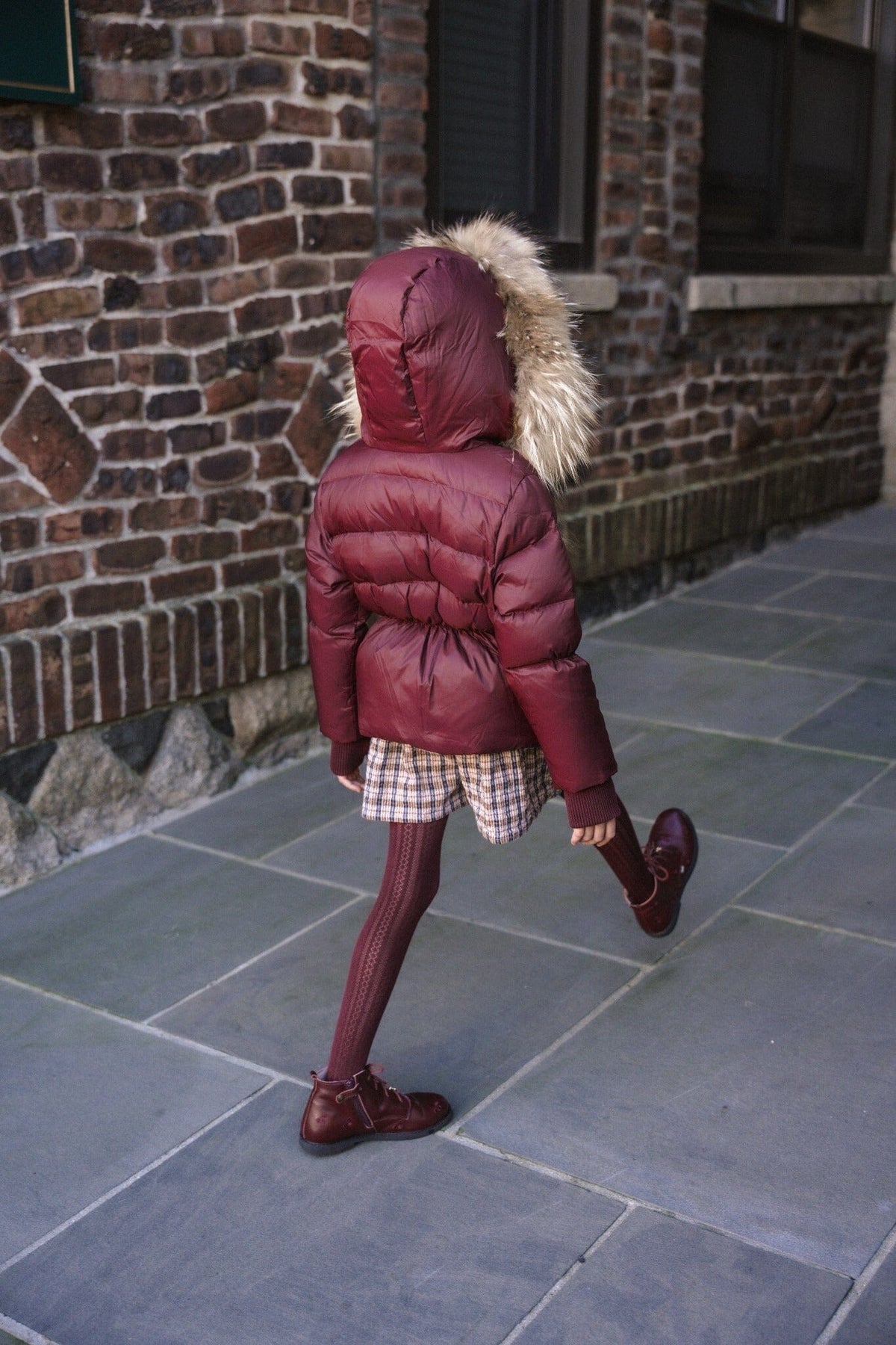 The Waypoint Girls Peplum Coat in Burgundy — lifestyle photo