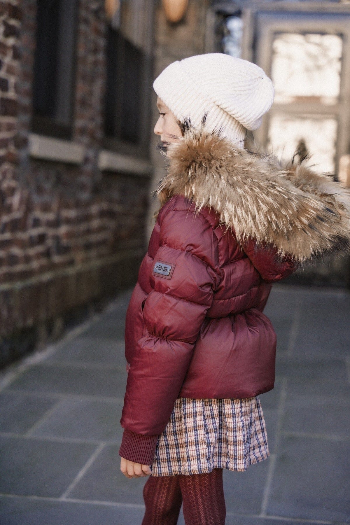 The Waypoint Girls Peplum Coat in Burgundy — lifestyle photo