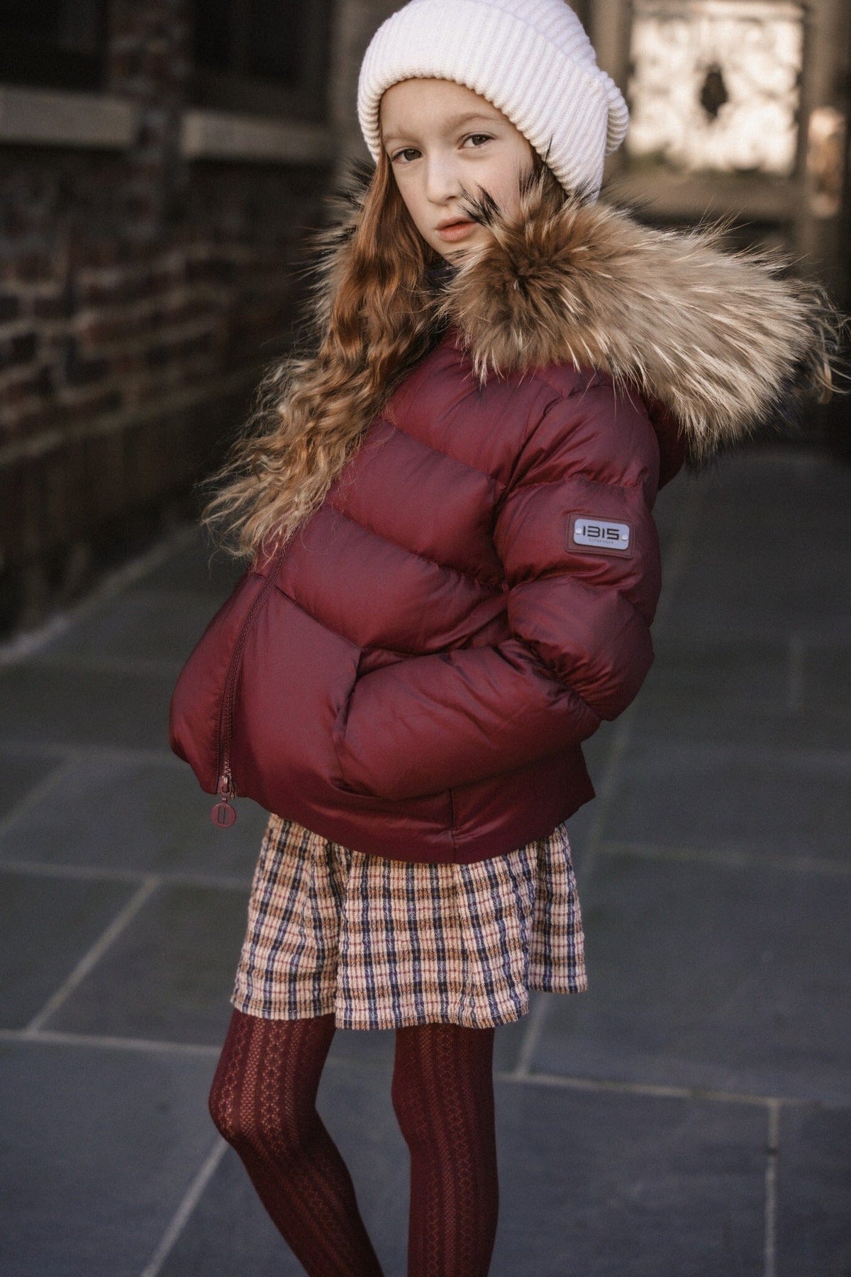 The Waypoint Girls Peplum Coat in Burgundy — lifestyle photo