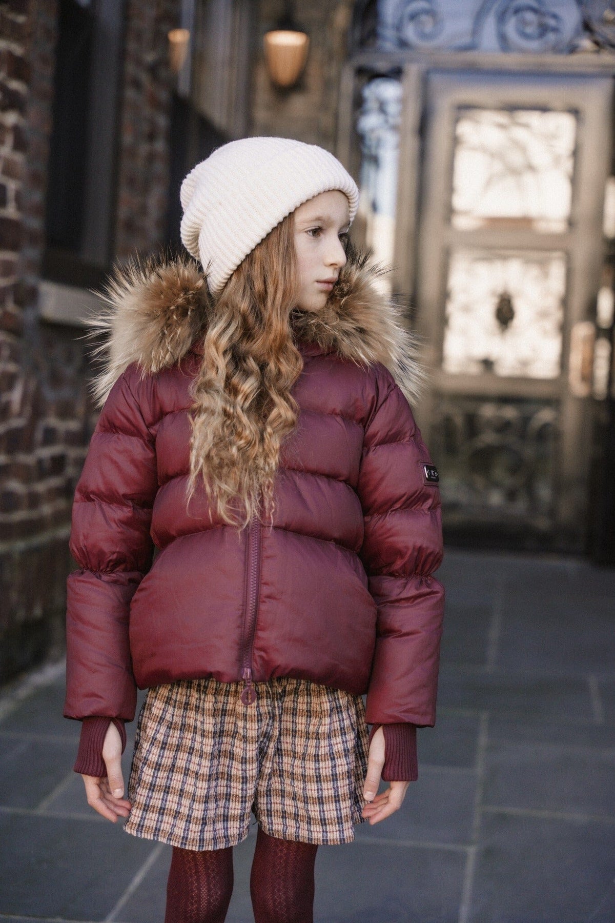 The Waypoint Girls Peplum Coat in Burgundy — lifestyle photo