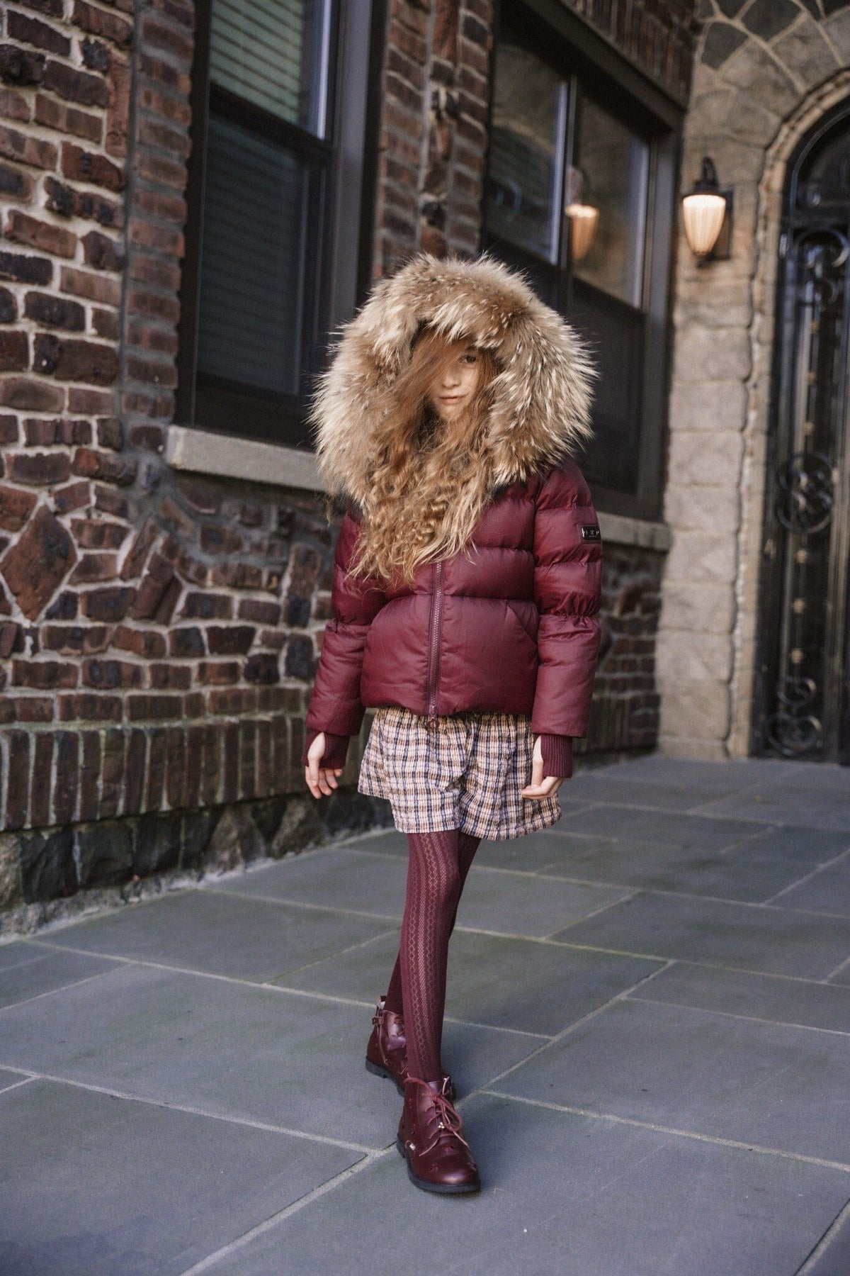 The Waypoint Girls Peplum Coat in Burgundy — lifestyle photo